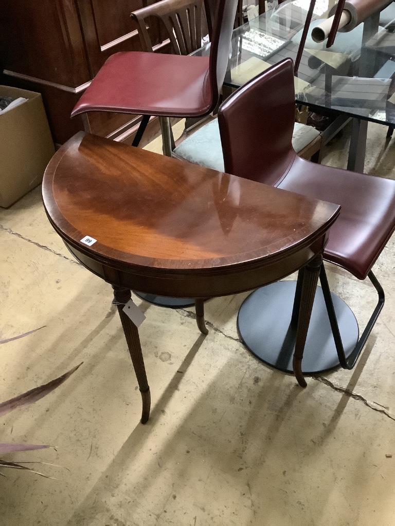 A reproduction mahogany D shape folding tea table, width 79cm, depth 39cm, height 73cm